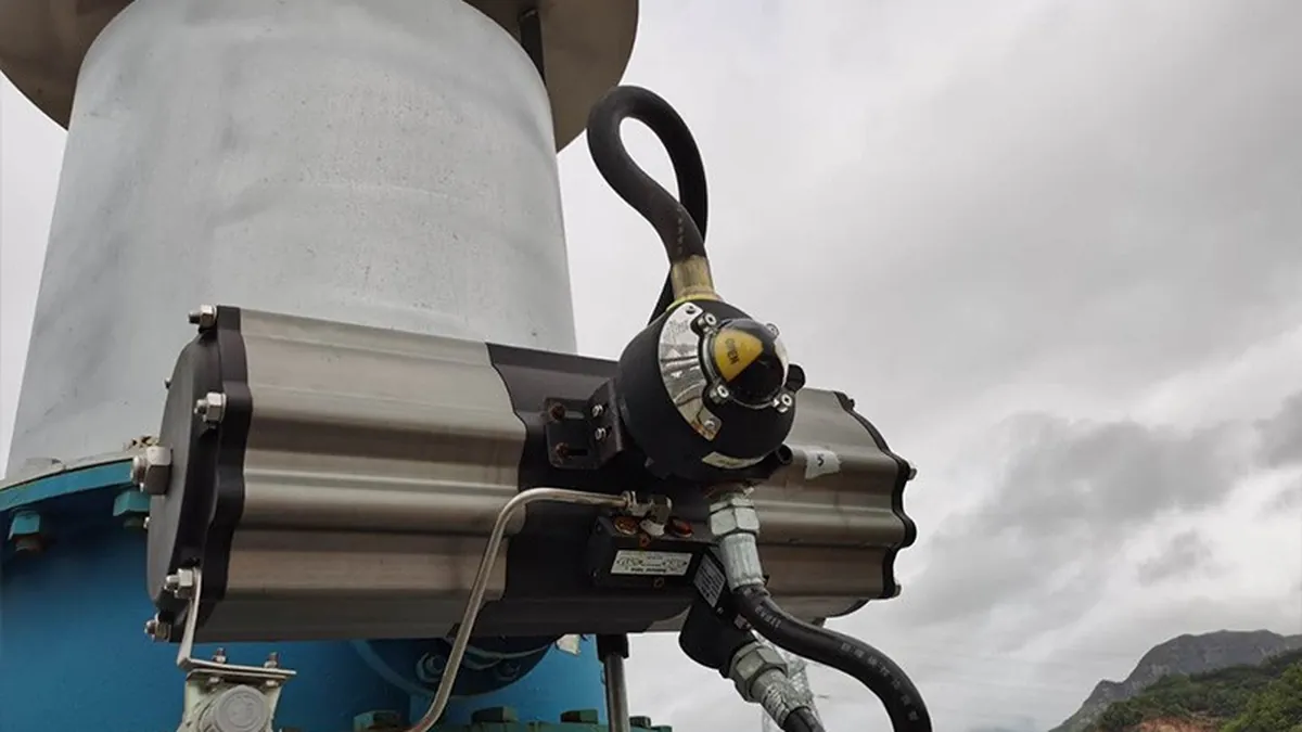 Operator checking torque on a field-mounted valve actuator