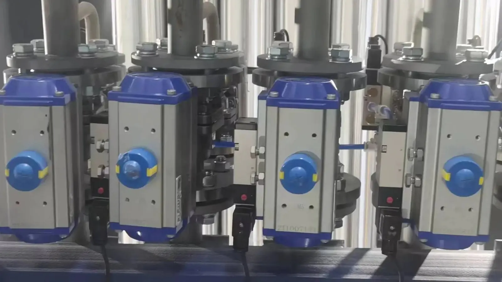 Stacked pneumatic actuator bodies with spring cartridges in a warehouse